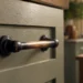 Close-up of an oil rubbed bronze handle with the grip point worn lighter from daily use