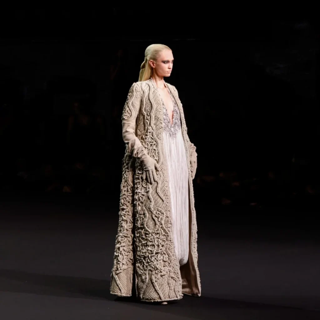Cream satin macramé floor-length coat over pleated gown