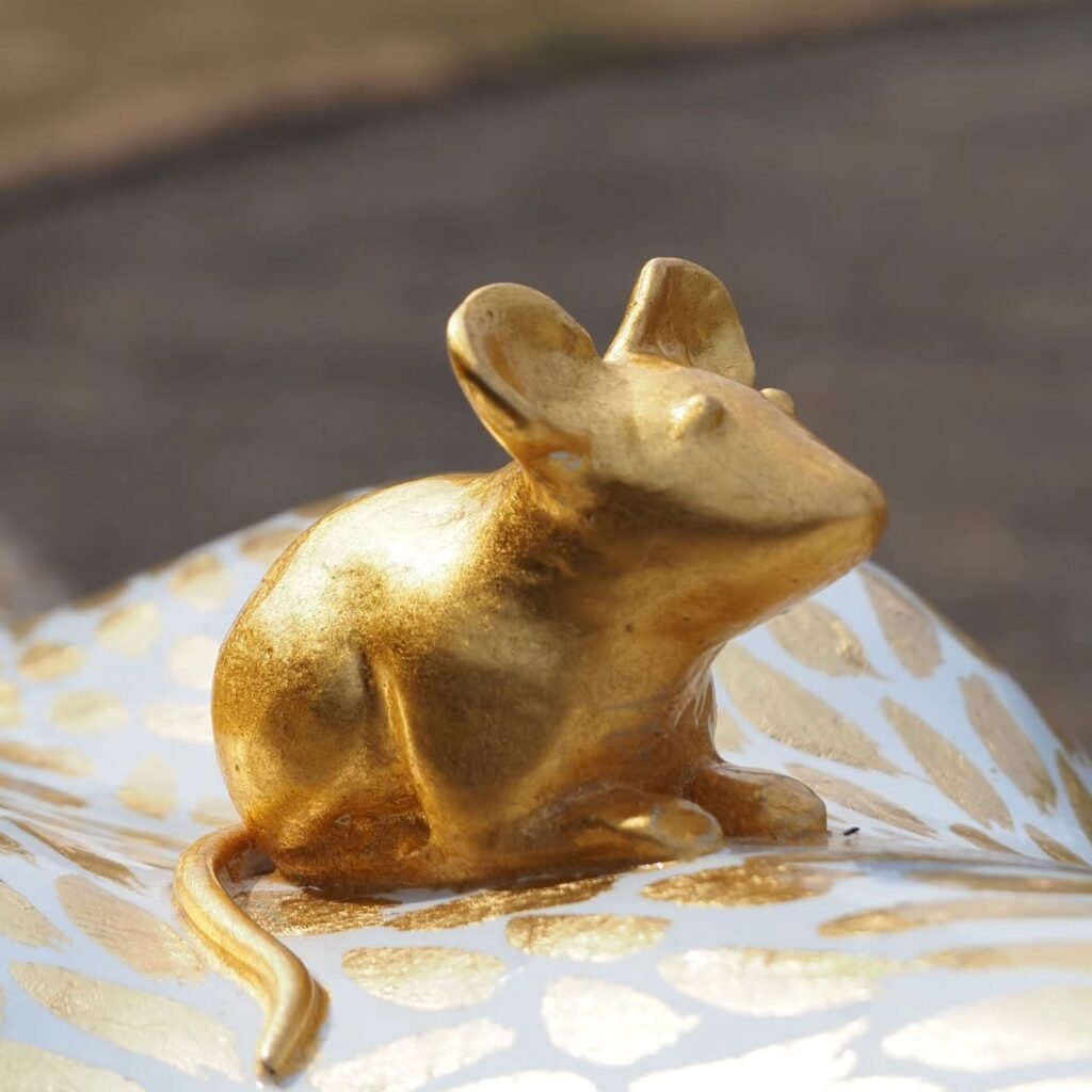 Cutlery-illustrated lion and the golden mouse detail from Pride of Yorkshire sculptures in Sheffield