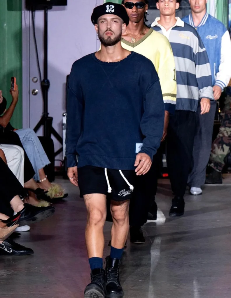 Four male models walking together