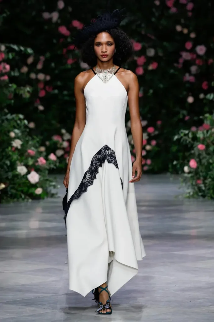 Look from the Bibhu Mohapatra Spring 2027 runway against the rose wall
