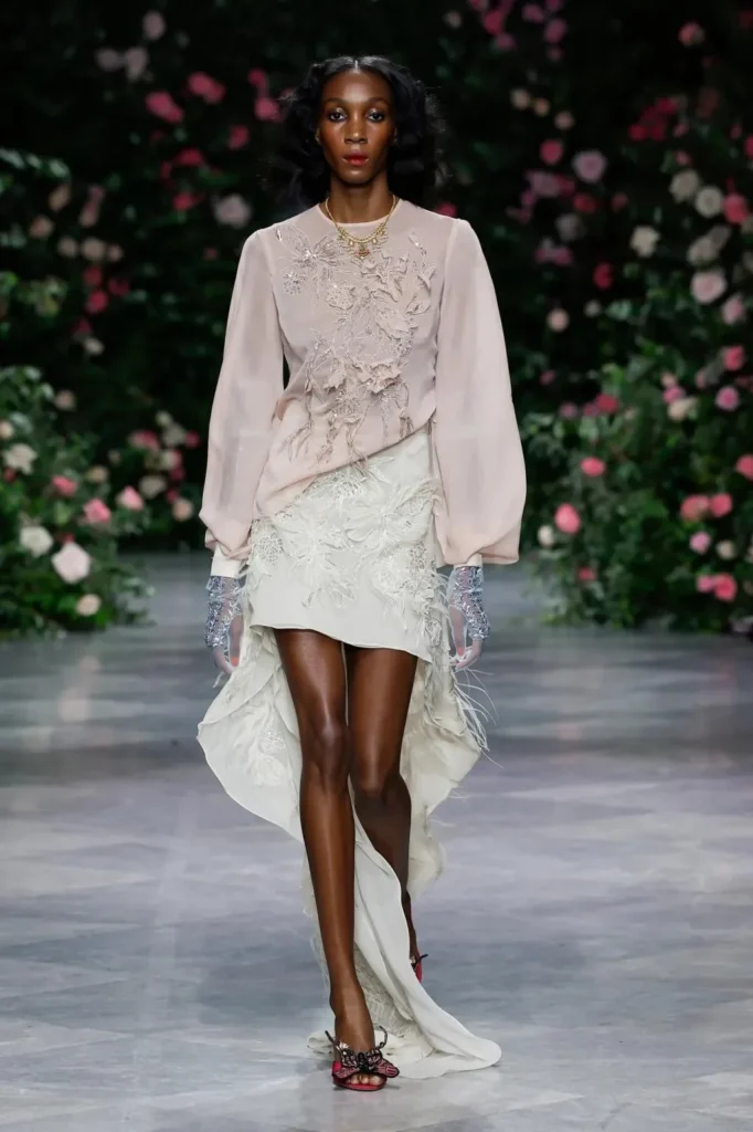 Look from the Bibhu Mohapatra Spring 2027 runway against the rose wall
