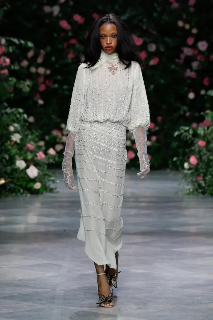 Look from the Bibhu Mohapatra Spring 2027 runway against the rose wall