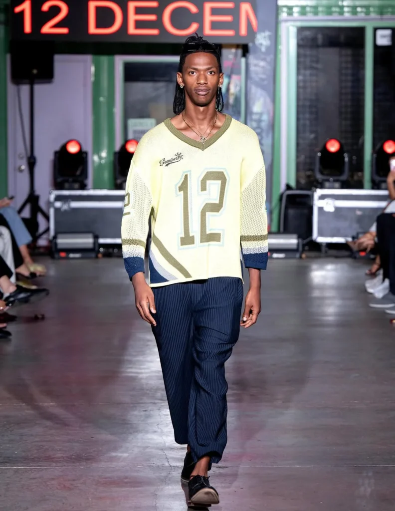 pale yellow knit jersey with olive trim and a large number 12